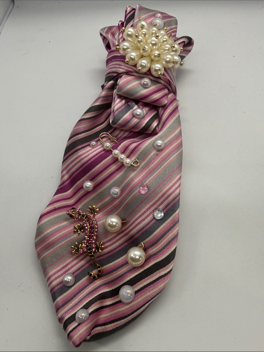 Stylish Pink Striped Silk Scarf with Pearl Brooch Accents
